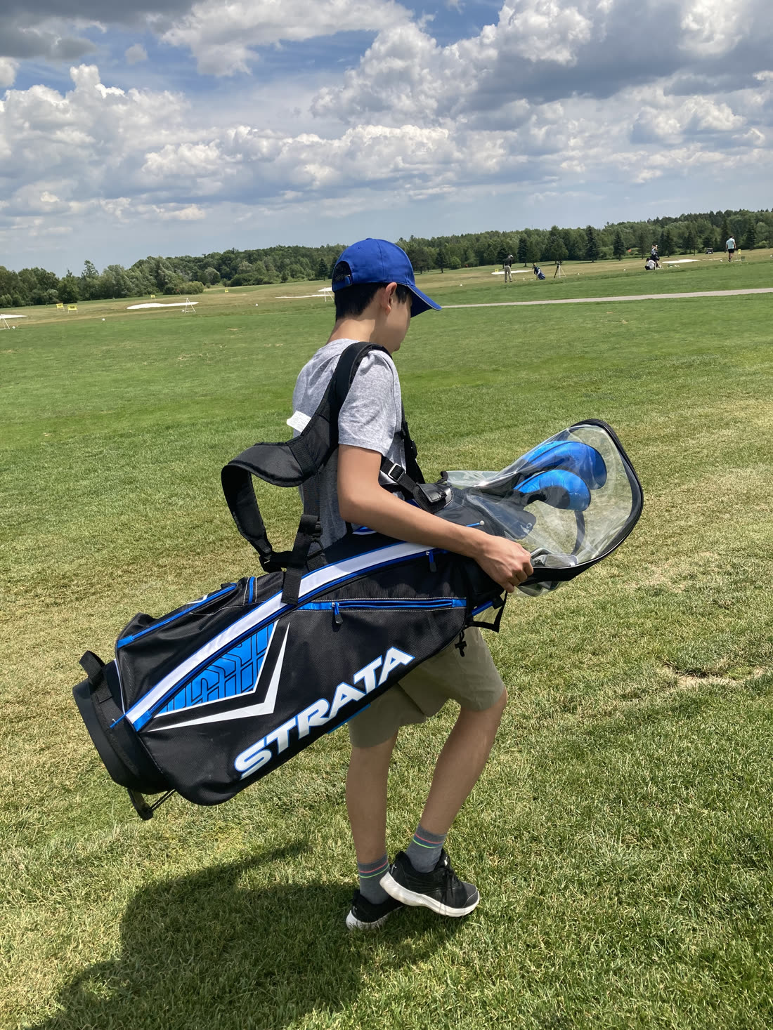 Carrying a bag out to the range.